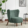 Moderne beklede armloze accentstoel met zachte zitting en frame van massief hout