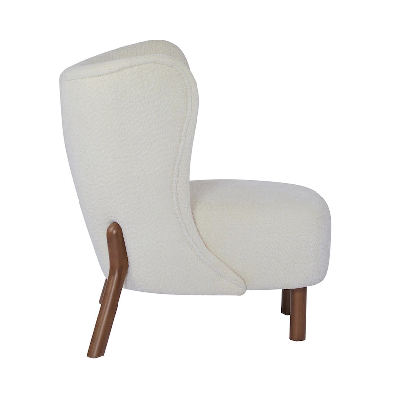 Moderne beklede armloze accentstoel met zachte zitting en frame van massief hout