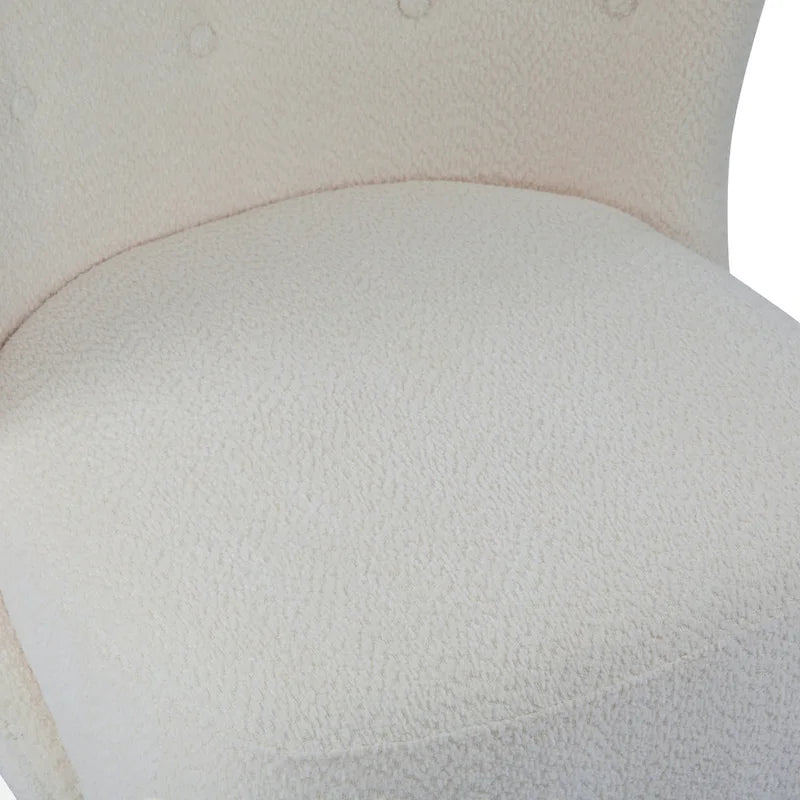 Moderne beklede armloze accentstoel met zachte zitting en frame van massief hout