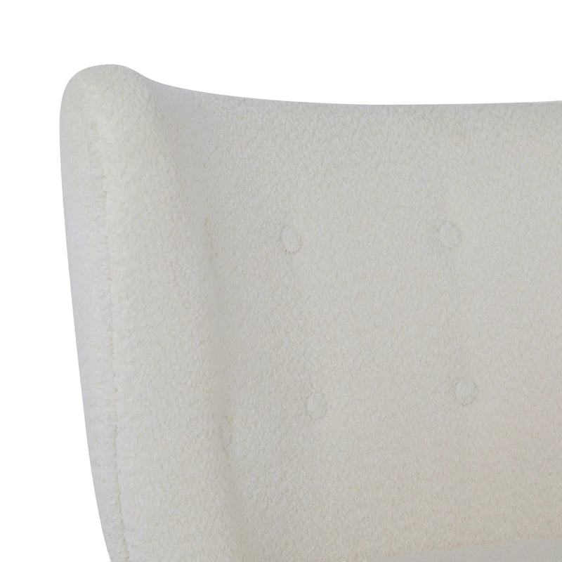 Moderne beklede armloze accentstoel met zachte zitting en frame van massief hout