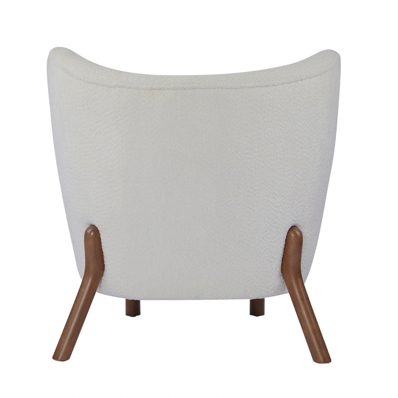 Moderne beklede armloze accentstoel met zachte zitting en frame van massief hout