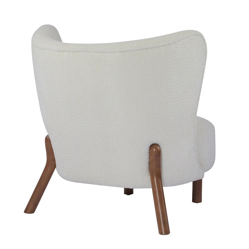 Moderne beklede armloze accentstoel met zachte zitting en frame van massief hout